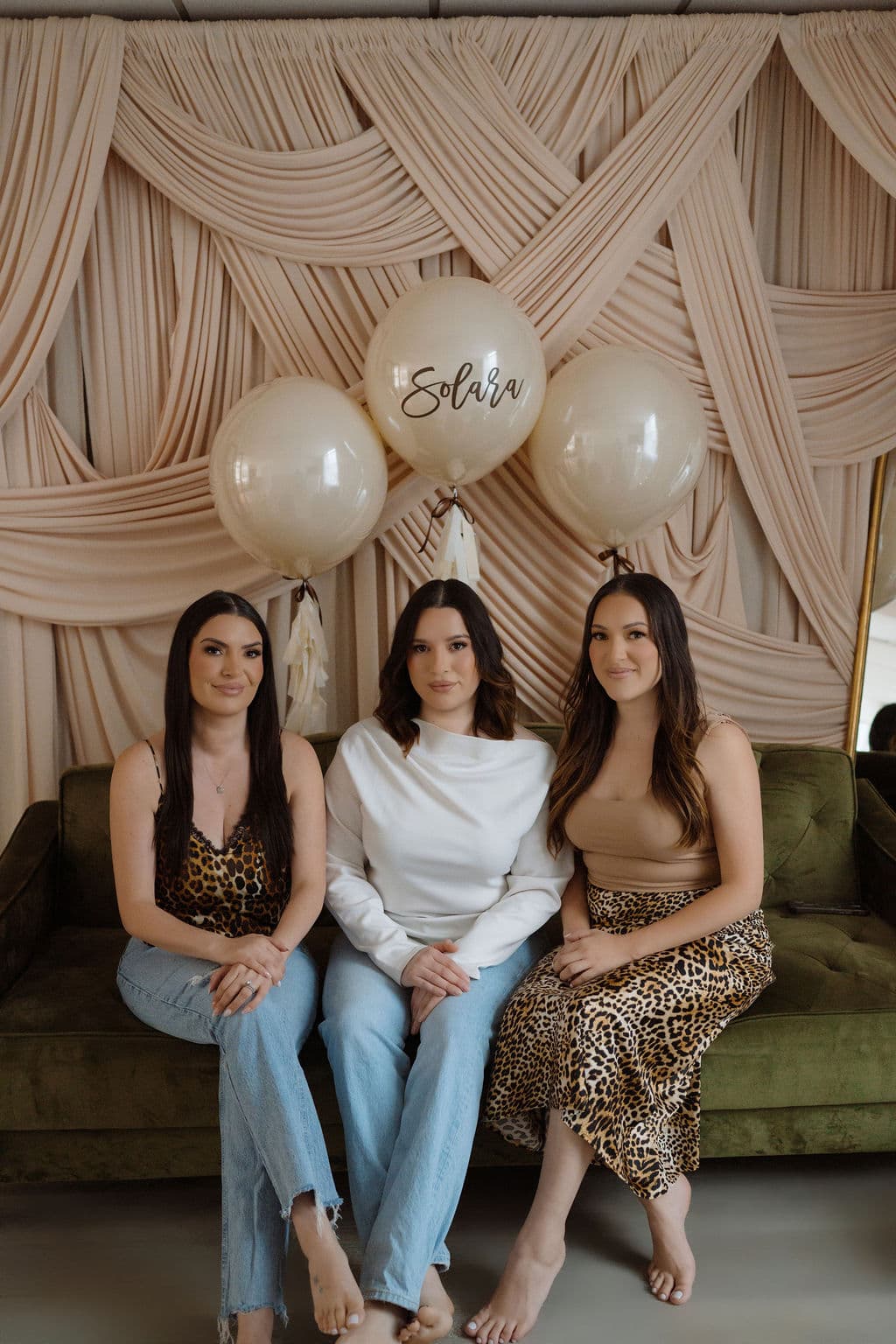 Engagement toast framed by warm white Marry Me letters